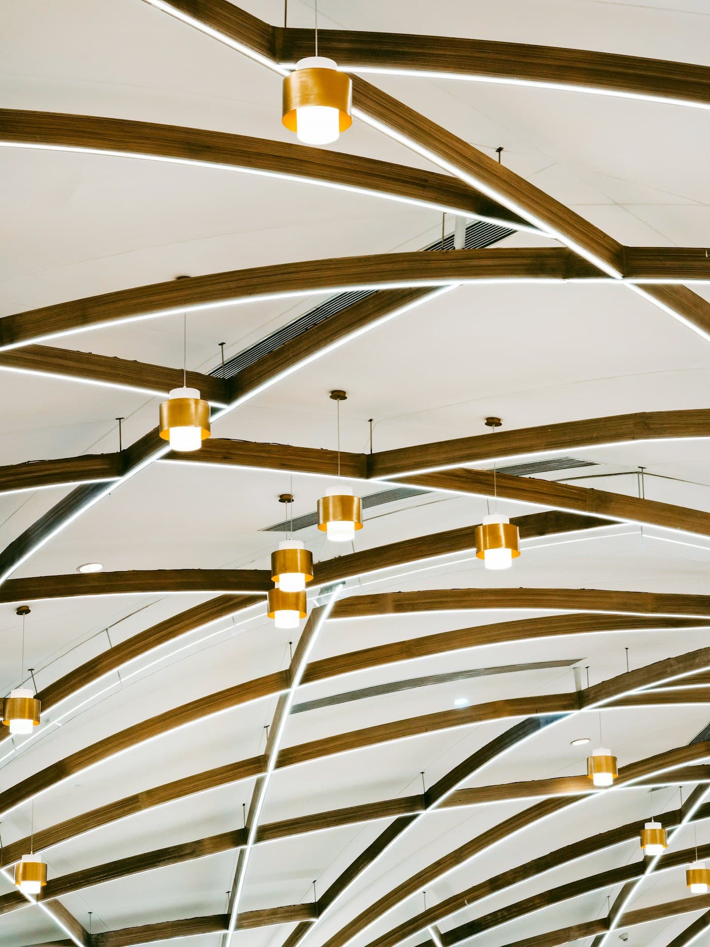 Feature ceiling with timber beams and pendant lights
